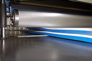 Laminated foam sheets exiting machine